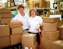 Picture of volunteers with boxes full of braille books