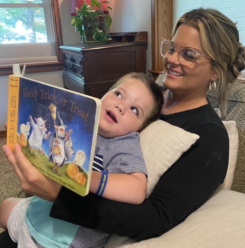 Andrew-Why-Braille Photo of mother reading to a young boy