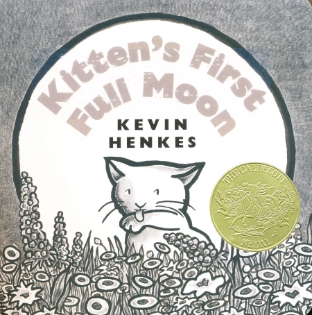 The front cover of the book shows a full moon in the background with a white cat licking its paw in a field of wildflowers.