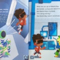 Interior spread with print and braille for Braille Boy with a picture of Braille Boy facing off against his nemesis, Braille Alien