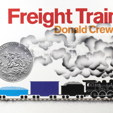 Cover of Freight Train with braille, a colorful train, and a silver Caldecott Honor award