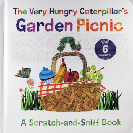 Cover of The Very Hungry Caterpillar's Garden Picnic with print and braille and a picture of the Very Hungry Caterpillar on a picnic basket