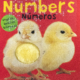 Cover of Numbers Numeros with print and braille on a red background and a tactile, fuzzy yellow duck