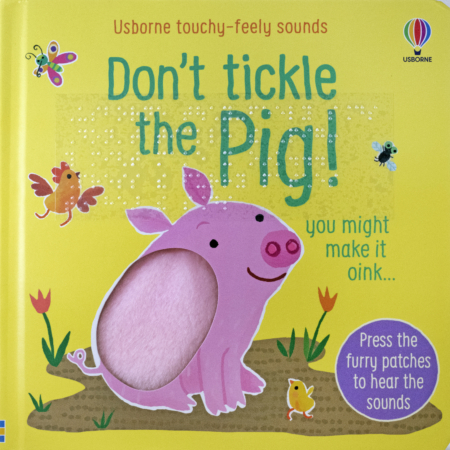 Cover of Don’t Tickle the Pig! with a pink tactile pig on a yellow book with print and transcribed braille