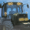 Interior spread with print and braille for Touch and Feel Tractor showing a tractor on a blue background with sparkly, tactile lights