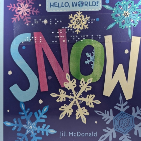 Cover of Hello World! Snow with print, braille, and a blue background with snowflakes.