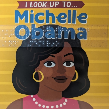 Cover of I Look Up to Michelle Obama with picture of Michelle and braille