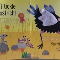 Interior spread with print and braille for Don’t Tickle the Monkey! with a picture of an ostrich