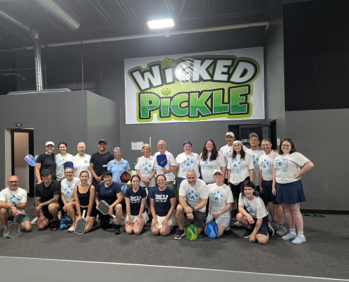 A group gathered at the Seedlings Pickleball tournament.