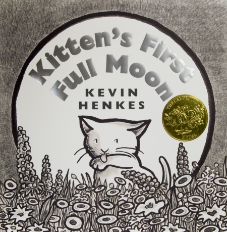 A kitten sits and licks its paw, illustrated in a monochromatic art style. It sits in a field of flowers with a full moon as the backdrop.