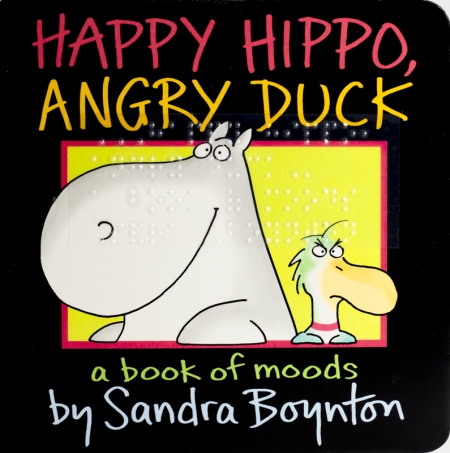 A cartoon hippo and duck sit beside one another; the hippo smiles and the duck frowns. They are framed by a yellow rectangle against a black background.