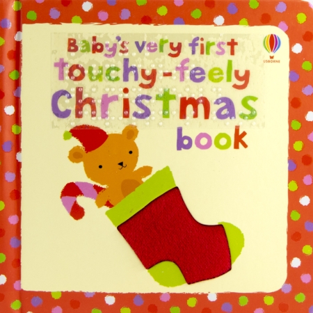 A tactile felt stocking. It contains a teddy bear with a hat, and a candy cane.