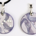 Braille clay charm necklace that says wish