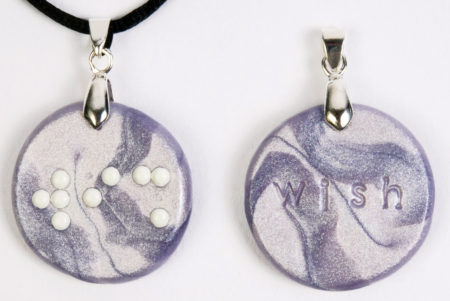Braille clay charm necklace that says wish