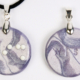 Braille clay charm necklace that says wish