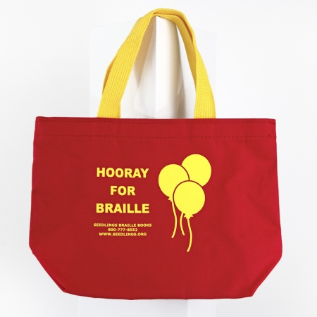Hooray for Braille red tote bag with yellow writing