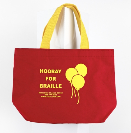 Hooray for Braille red tote bag with yellow writing