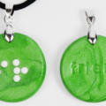 Braille clay charm necklace that says friend